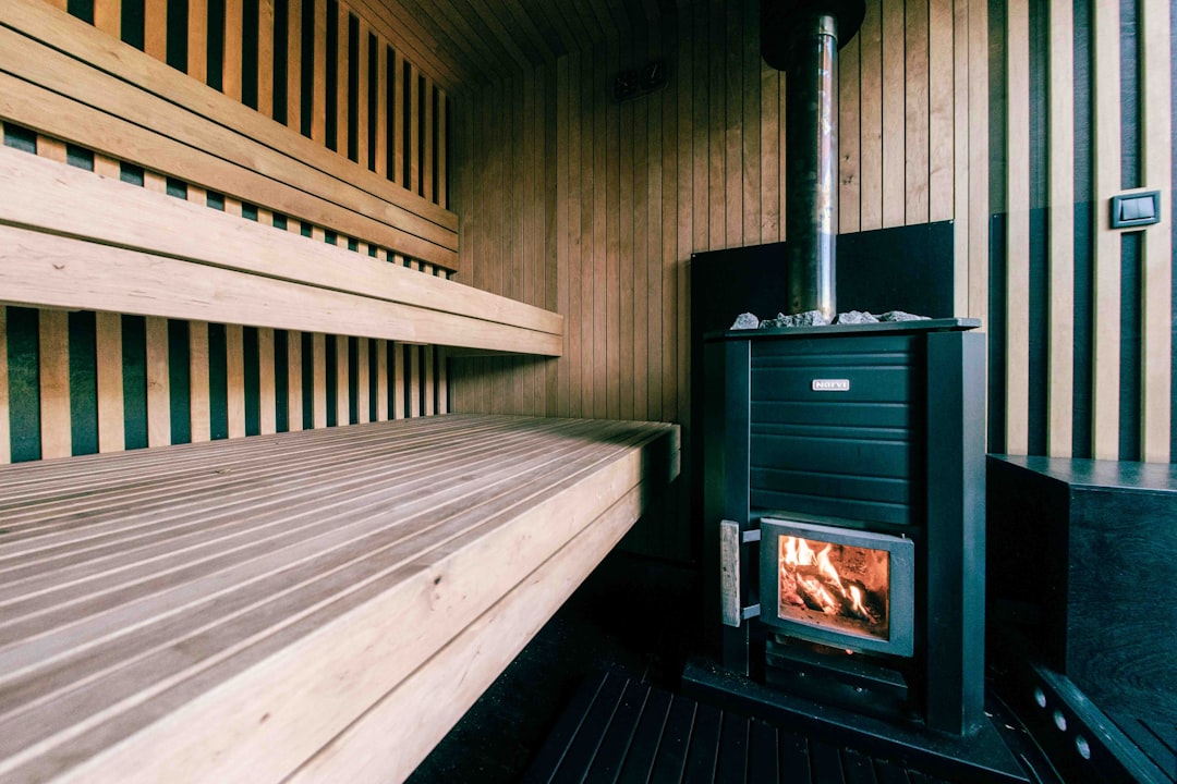 services-03 a-wood-burning-stove-inside-of-a-wooden-room-acaqcxlxsy0
